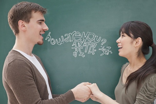 Students-in-front-of-chalkboard-holding-hands.jpg